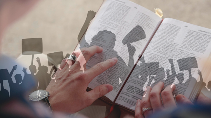 Open Bible with someone hands to turn pages and shadows of protesting people over it all 